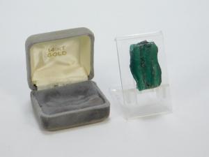 Natural Colombian trapiche emerald, unpolished with a vibrant green coloration (estimate: $3,000-$5,000).