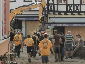 Scientologists coordinated with the fire brigade and joined teams digging the town out of the mud.