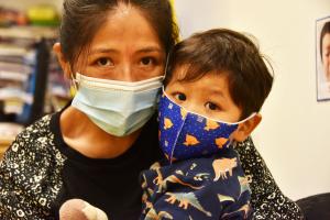 Mom and Child with masks served by Association to Benefit Children in New York