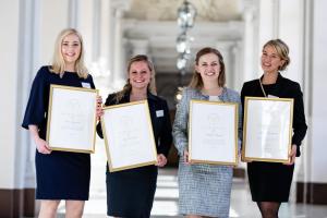 The four winners of the 2018 Queen Silvia Nursing Award are lined up in a sun-filled Royal Palace in Stockholm for a group photo to celebrate their achievements.