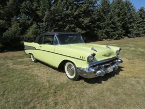 1957 Chevrolet Bel Air Convertible, an AACA Junior and Senior Award winner, a frame off restoration, great-looking yellow with black convertible top.