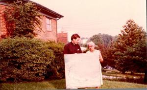 Delilah W. Pierce Holding Her Painting Outside Washington, DC Home