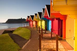 Colorful beach huts near ocean