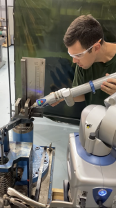 Governor Control Systems Technician Michael Morel Prepares to Install a Woodward Varistroke Actuator