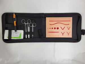 this is an image of a suture kit. included is a suture pad and other suture materials