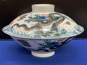 This graceful porcelain dragon bowl with Yongzheng mark sold for $200,000.