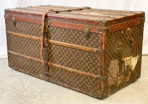 This early 20th Century Louis Vuitton steamer trunk adorned with various travel stickers sold for $12,250.