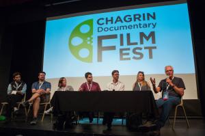 filmmakers sit on stage and talk as part of a panel