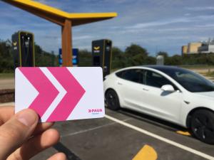Image showing a Paua RFID card (pink chevrons on a white card) with a Fastned charging station in Kent in the background