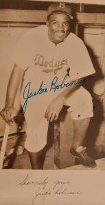 Scarce circa 1950-1951 Jackie Robinson autographed photo, early first issue with a letter of authenticity from James Spence.