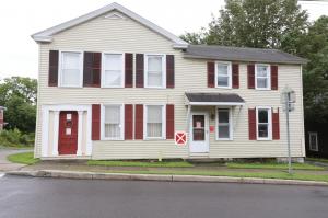 Two-story, two-family old-style residence at 36 Farnham Street in Cazenovia, N.Y., situated on about one-tenth of an acre, built around 1838.