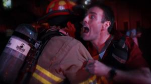 Radovan (Mickey O'Sullivan) tries to rescue Ava (Lorrisa Julianus) from a burning church in The Misadventures of Mistress Maneater