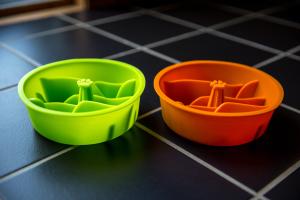 Bright orange and green slow feed dog bowl inserts from Mighty Paw
