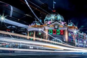 A photograph taken at night of Flinders Street Station in Melbourne