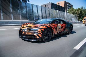 Bugatti Chiron wrapped in tiger stripes, emblazoned with Tiger King Coin and Joe Exotic decals