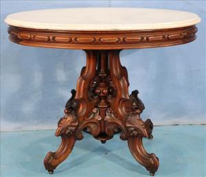 Walnut Victorian oval center table by Thomas Brooks, with white marble, 29 inches in diameter (estimate: $1,200-$2,000).