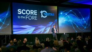 Scott standing on stage hosting a national sales meeting