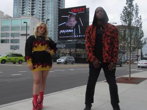 Juliana and Derek Minor in front of Nashville Billboard for 'Crazy'