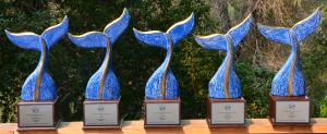 Row of award statues shaped like whale tails
