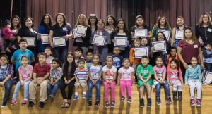 Wellness for Growth program graduation showcasing program beneficiaries and their children at Bear Creek Elementary.