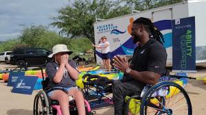 Wheelchair Basketball Player Matt Scott talking with young athlete