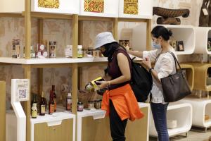 two woman see at showcased product