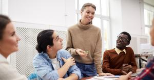 A happy group of coworkers show that an engaged team results in a positive work environment and improved collaboration.