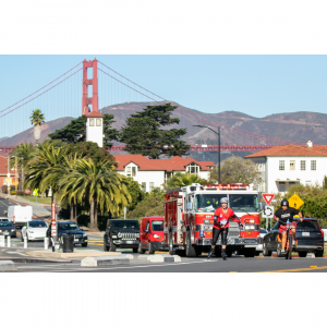 Dr. Christine Ichim rollerblading across San Francisco accompanied by Lt. Julie DeJarlais and SFFD engines to raise awareness of the importance of cancer prevention in the fire services