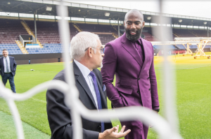 Malcolm Jenkins and Burnley F.C. Chairman, Alan Pace chat at the Turf Moor stadium.