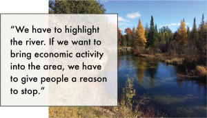 A photo of the Platte River and a quote regarding the importance of the river in drawing more people to Honor, MI.