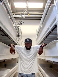 Desmond Hayes, founder and president of GeoGreens, LLC, in his new hydroponic farm in Mill One at Hamilton