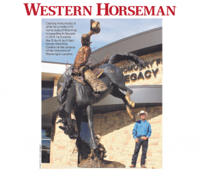 Artist Chris Navarro with monument Wyoming Cowboy at University of Wyoming