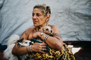 ompanion animals provide unconditional love, friendship, a sense of structure and responsibility for their homeless caretakers.