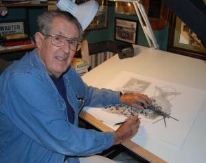 Artist Dick Kramer at the board drawing