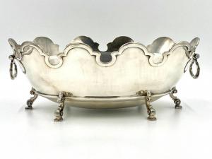 Large Tiffany & Company monteith, circa 1966, raised on baroque style scroll legs, weighing 109.375 oz. troy ($4,305).
