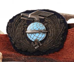 German officer's cap, badge and relics from the Hindenburg disaster, gathered by Thomas J. Evans, United States Coast Guard (estimate: $10,000-$15,000).