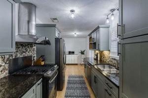 Move-in ready 3 bedroom 2 bath 1,834± square foot home - New roof & gutters, water heater, 8 foot privacy fence - Heated floors in master bathroom, custom closets - Wi-Fi enabled smart locks, a Nest thermostat - Updated baths & kitchen with new appliances & fixtures 