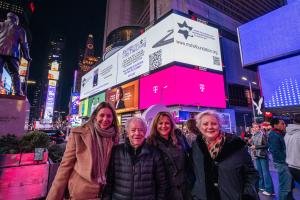Mark Schonwetter and his family, daughters Ann and Isabella and wife Luba, in Times Square at the launch of the Journey For The Living Challenge