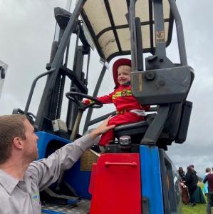 Trick or Treater sitting in MyWay Mobile Storage forklift