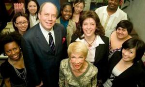 mutliethnic staff is posing together in a group
