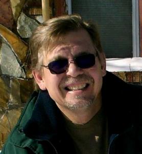 <img src="author oliver phipps.jpg" alt="oliver phipps with sunglasses on and smiling">