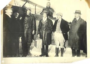 Photo taken in April 1928 showing Admiral Byrd, holding a package of anti-pneumonia serum, flanked by aviation pioneer Charles Lindbergh, in Canada..