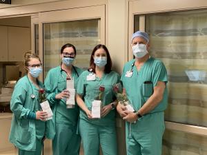 Nurses and doctors receiving the Kindness rose gifts.