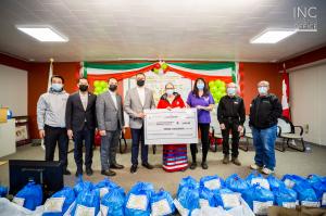 Ministers of the Iglesia Ni Cristo are joined by Brian Panasiuk, mayor of High Prairie, and Darlene Moostoos, Executive Director of Sucker Creek Women’s Emergency Shelter.  Ministers of the Church presented a cheque donation of $3,000 and hundreds of care packages.