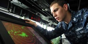 U.S. Navy Petty Officer 2nd Class Michael R. Gutermuth reads the SPS 73 radar on the bridge of the amphibious transport dock ship USS San Antonio (LPD 17). DoD photo by Petty Officer 3rd Class Zachary S. Welch, U.S. Navy.