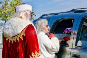 Santa and Mrs. Claus Greet Children at Project Boon's Christmas Event