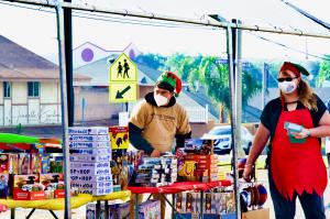 A volunteer prepares to hand out toys at Project Boon's Christmas Event