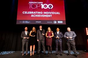 People accepting award at ceremony in Liverpool
