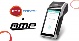 POPcodes and AMP logos with AMP payment terminal device. Indicates POPcodes app and cloud solution is now available on AMP devices.