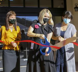 Darolyn Jorgensen – Chief Operating Officer, Kelly Conk – The Orchards Healthcenter Administrator, and Suzanne Nasraty – Reata Glen Executive Director cut the ribbon at the first anniversary and grand opening ribbon cutting. 